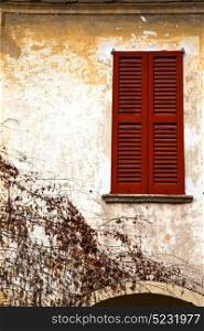 shutter europe italy lombardy in the milano old window closed brick abstract grate red