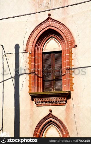 shutter europe italy lombardy in the milano old window closed brick abstract grate red