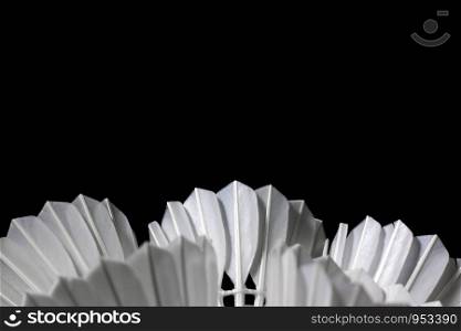 Shuttlecock in a badminton tournament on a black background.