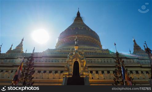 Shwezigon Pagoda is one of the oldest sacred golden buddhist pagoda in Myanmar. Town of Nyaung-U near ruins of Bagan, Myanmar