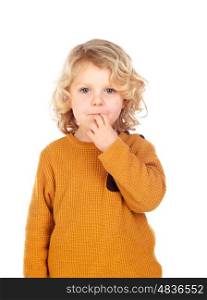 Shy small child with yellow jersey isolated on a white background