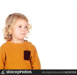 Shy small child with yellow jersey isolated on a white background