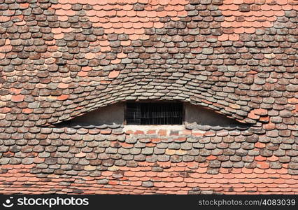 sibiu city romania traditional architecture detail roof tile eye