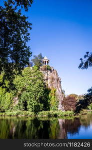 Sibyl temple and lake in Buttes-Chaumont Park, Paris, France. Sibyl temple and lake in Buttes-Chaumont Park, Paris