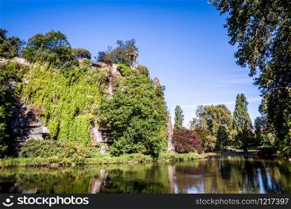 Sibyl temple and lake in Buttes-Chaumont Park, Paris, France. Sibyl temple and lake in Buttes-Chaumont Park, Paris