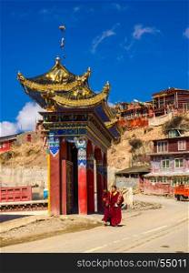 Sichuan, China - April 10, 2017 : Buddhist monks walking along the street in Yarchen Gar Monastery in Sichuan, China
