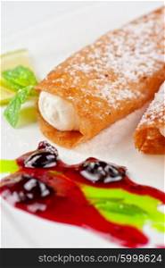 Sicilian cannoli at plate. Sicilian cannoli at plate decorated with lime and jam