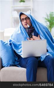 Sick businessman working from home due to flu sickness