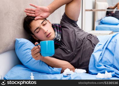 Sick ill man in the bed taking medicines and drugs