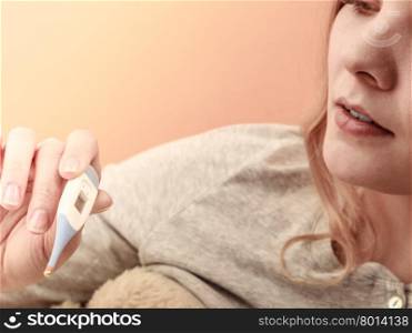 Sick ill woman with digital thermometer.. Sick ill woman with digital thermometer. Young girl having high fever measuring temperature. Health.