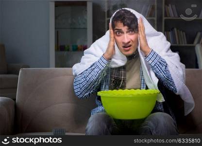 Sick man doing inhalation at night in home