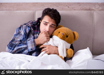Sick man suffering from flu in the bed