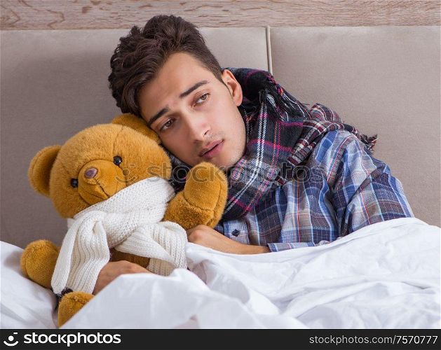 Sick man suffering from flu in the bed. The sick man suffering from flu in the bed