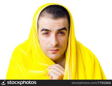 Sick man with fever in a yellow blanket