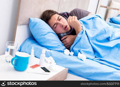 Sick man with flu lying in the bed