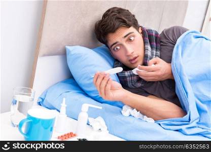 Sick man with flu lying in the bed