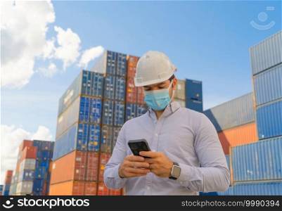 Sick middle east logistic worker engineer man working in cargo container,wearing a face mask in warehouse industry factory site. Export, import concept. Business people. Corona virus and health care.