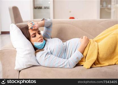 Sick pregnant woman suffering at home