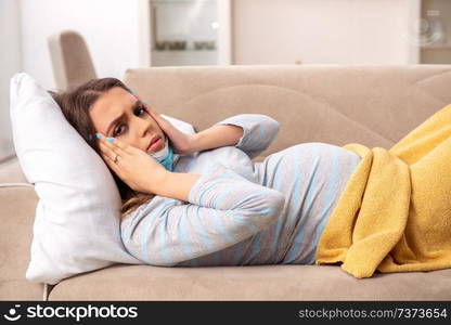 Sick pregnant woman suffering at home 