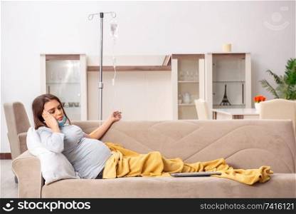 Sick pregnant woman suffering at home 
