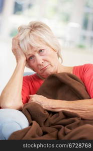 Sick, unhappy older woman at home