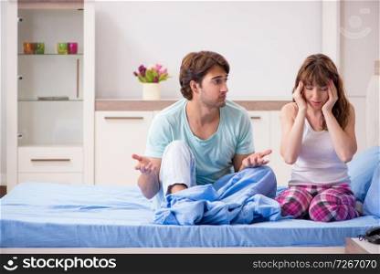 Sick young woman with husband in the bedroom 