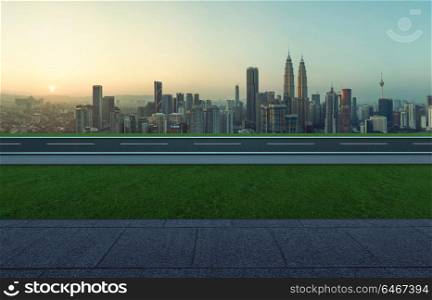 Side angle view empty asphalt road with grass ,stone marble floor and city skyline background . Mixed media .