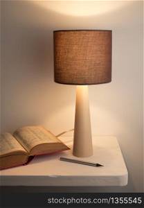 Side bed lamp with dictionary book. Learning or travel concept