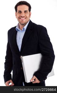 Side ciew of young man holding laptop against an isolated background