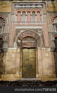 Side door to the Mezquita (The Great Mosque, Mosque Cathedral) in Cordoba, Spain, fine example of Islamic architecture.