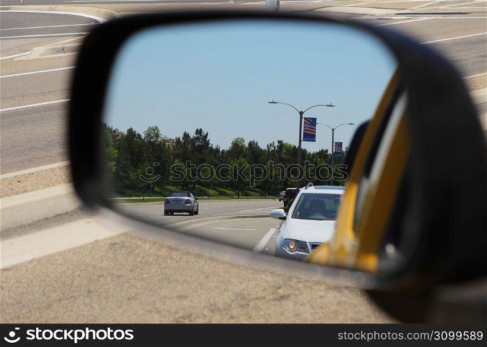 side mirror view of a road