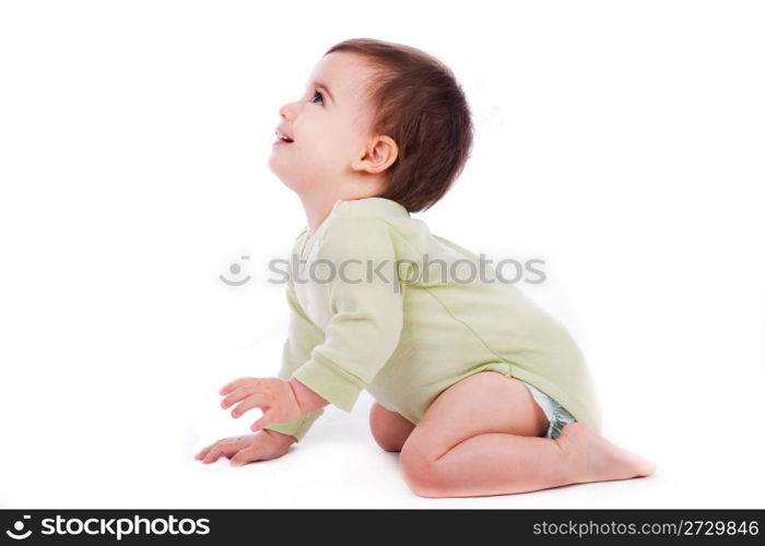 Side pose of baby sitting and looking up in white background