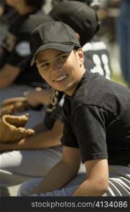 Side profile of a baseball player smiling