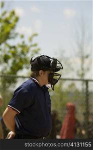 Side profile of a baseball umpire wearing a helmet