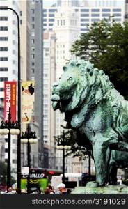 Side profile of a bronze lion statue, Art Institute of Chicago, Chicago, Illinois, USA