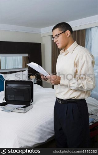 Side profile of a businessman holding a document