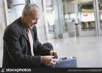 Side profile of a businessman smiling at an airport