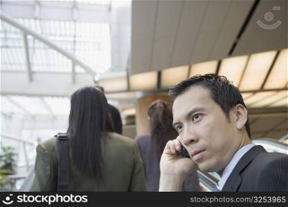 Side profile of a businessman talking on a mobile phone