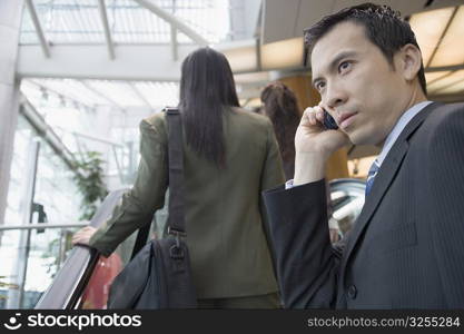 Side profile of a businessman talking on a mobile phone