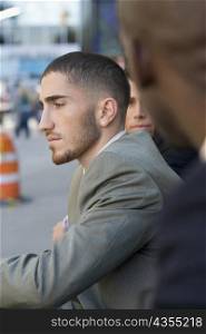 Side profile of a businessman thinking
