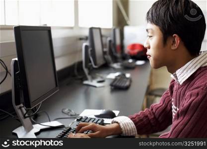 Side profile of a businessman using a computer