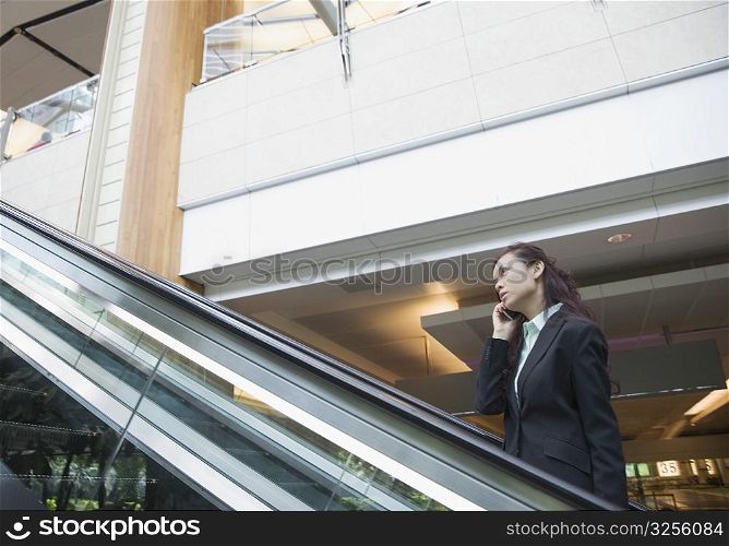 Side profile of a businesswoman talking on a mobile phone