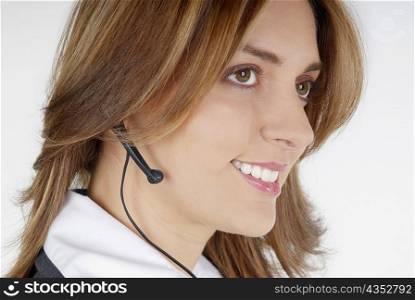 Side profile of a businesswoman with a hands free device
