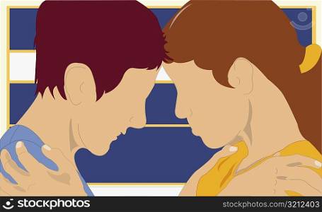 Side profile of a couple embracing each other