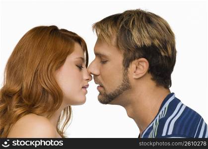 Side profile of a couple kissing each other