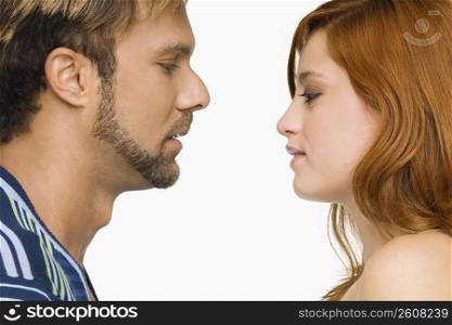 Side profile of a couple looking at each other