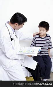Side profile of a doctor holding the report of a child