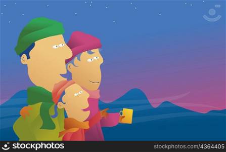 Side profile of a family looking at the night sky