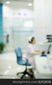 Side profile of a female nurse sitting on a chair