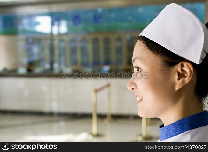 Side profile of a female nurse smiling